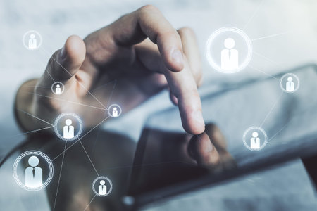Double exposure of social network icons concept with finger clicks on a digital tablet on...
