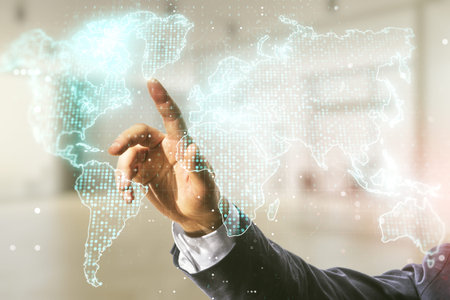Man hand working with abstract creative world map interface on blurred office background,...