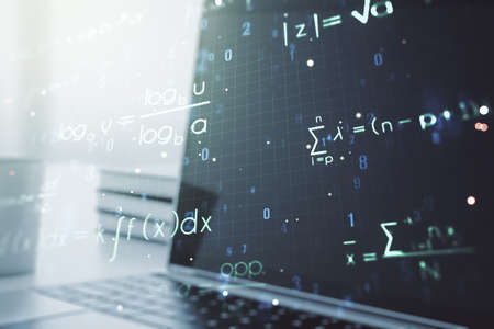 Creative scientific formula concept on modern laptop background. Multiexposureの写真素材