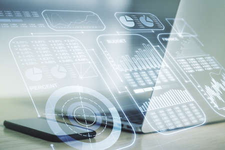 Double exposure of abstract creative statistics data hologram on laptop background, statistics and analytics conceptの写真素材
