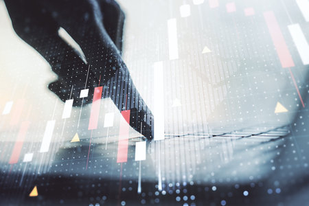 Abstract creative financial graph with world map and hands typing on laptop on background, financial and trading concept. Multiexposureの写真素材
