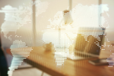 Abstract creative world map on modern laptop background, international trading concept. Multiexposureの写真素材