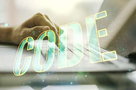 Creative Code word hologram and hands typing on computer keyboard on background, artificial intelligence and neural networks concept. Multiexposureの写真素材