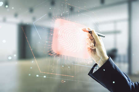 Multi exposure of man hand with pen working with virtual fingerprint scan interface on blurred office background, digital access conceptの写真素材