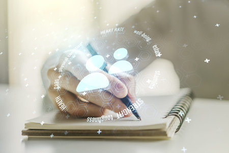 Double exposure of people icons hologram and man hand writing in notebook on background. Online...