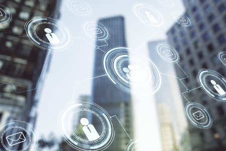 Double exposure of social network icons hologram on blurry cityscape background. Networking concept
