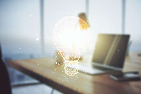 Creative light bulb hologram on modern laptop background, idea concept. Multiexposureの写真素材