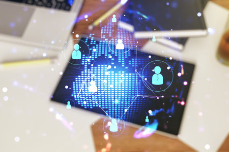 Social network media concept with world map and modern digital tablet on desktop on background, top...