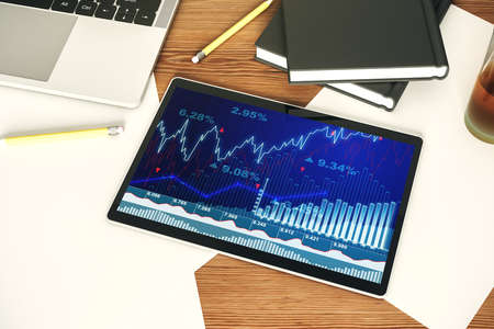 Digital tablet with abstract financial graph, finance and trading concept. Top view. 3D Renderingの写真素材