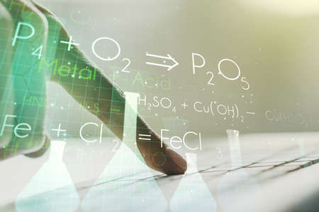 Creative chemistry illustration with hands typing on computer keyboard on background, science and research concept. Multiexposureの写真素材