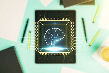 Creative artificial Intelligence concept with human brain hologram and modern digital tablet on background, top view. Multiexposureの写真素材