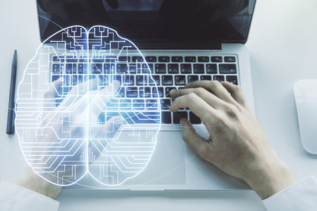 Double exposure of creative artificial Intelligence symbol with hands typing on laptop on...