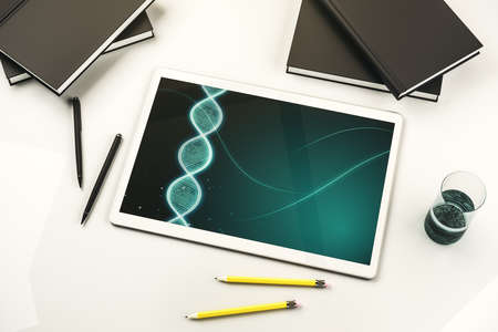 Creative concept with DNA symbol illustration on modern digital tablet screen. Genome research concept. Top view. 3D Renderingの写真素材