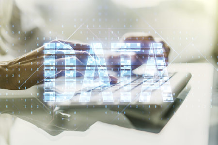 Creative Data word hologram and hands typing on computer keyboard on background, big data and...