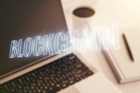 Creative abstract blockchain technology hologram on modern computer background, cryptography and decentralization concept. Multi exposureの写真素材