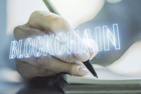 Creative concept of blockchain technology and woman hand writing in notebook on background. digital...