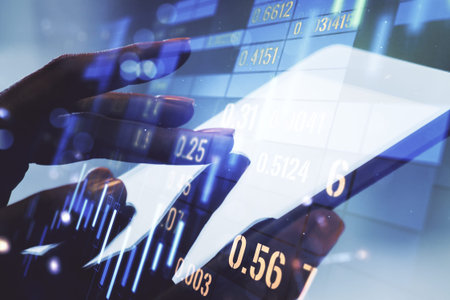 Abstract creative financial graph with finger clicks on a digital tablet on background, forex and...