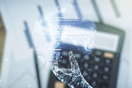 Double exposure of abstract digital world map hologram on calculator and papers background, big data and blockchain conceptの写真素材