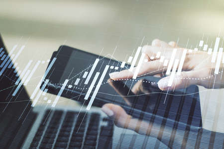 Double exposure of abstract creative financial diagram with finger clicks on a digital tablet on background, banking and accounting conceptの写真素材
