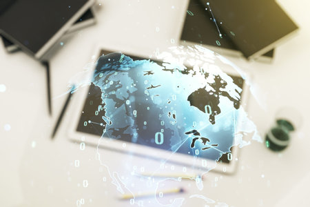Multi exposure of abstract creative coding sketch with world map and modern digital tablet on...