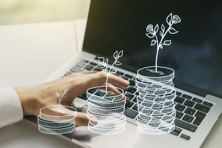 Creative abstract money savings sketch and hands typing on computer keyboard on background, accumulation and growth of money concept. Double exposureの写真素材