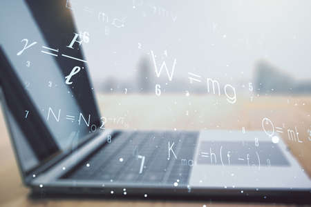 Creative scientific formula concept on modern laptop background. Multiexposureの写真素材
