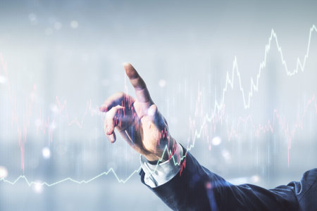 Man hand working with abstract virtual financial graph on blurred office background, forex and...