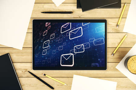 Creative abstract postal envelopes sketch on modern digital tablet screen, e-mail and marketing concept. Top view. 3D Renderingの写真素材