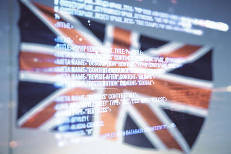 Abstract virtual coding illustration on British flag and sunset sky background, software development concept. Multiexposureの写真素材