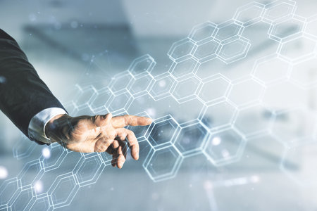 Man hand clicks on abstract virtual wireless technology hologram with hexagon on blurred office background. Big data and database concept. Multiexposureの写真素材