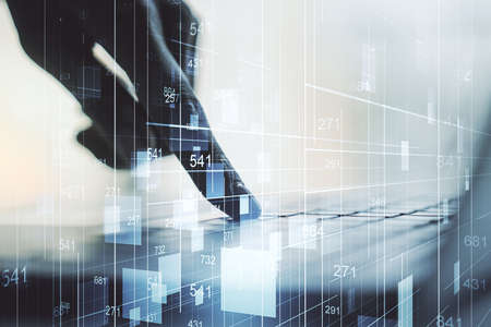 Double exposure of abstract creative statistics data hologram with hands typing on laptop on background, analytics and forecasting conceptの写真素材