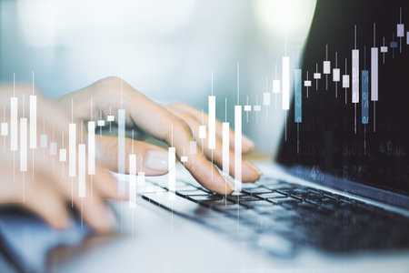 Multi exposure of abstract financial graph with hand typing on laptop on background, financial and...