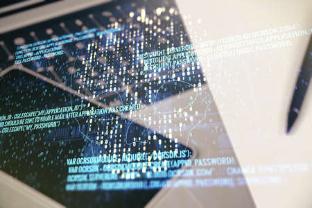 Creative code skull hologram on modern computer background, cybercrime and hacking concept. Multiexposureの写真素材