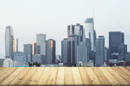 Table top made of wooden dies with beautiful Los Angeles skyline on background, mockupの写真素材