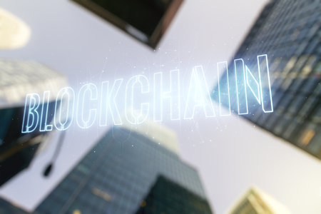 Abstract virtual blockchain technology hologram on modern architecture background, cryptography and decentralization concept. Multi exposureの写真素材
