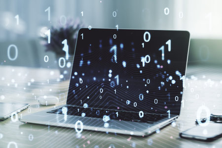 Creative concept of binary code illustration on modern laptop background. Big data and coding...