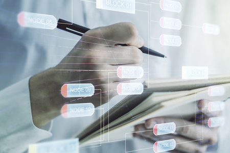 Multi exposure of abstract software development hologram and man hand writing in notebook on background, research and analytics conceptの写真素材