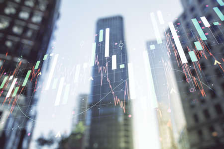Double exposure of abstract financial graph on office buildings background, financial and trading conceptの写真素材