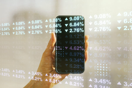 Double exposure of abstract creative statistics data hologram and hand with cellphone on background, analytics and forecasting conceptの写真素材
