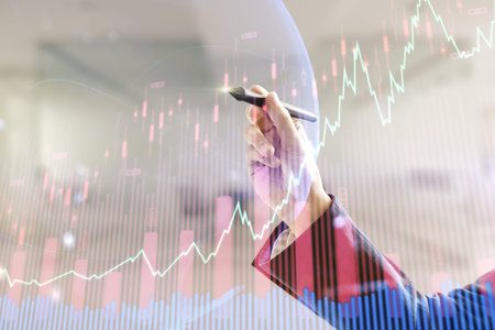 Man hand with pen working with abstract creative financial graph and world map on blurred office...