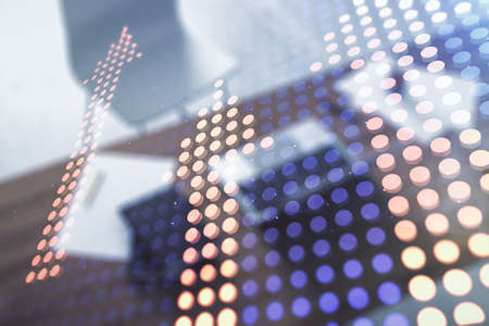Creative abstract upward arrows hologram and modern desktop with pc on background, leadership and motivation concept. Multiexposureの写真素材