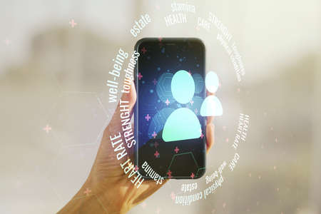 Creative abstract people icons sketch and hand with cellphone on background, life and real estate insurance online concept. Double exposureの写真素材