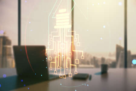 Creative light bulb with chip hologram and modern desk with computer on background, artificial Intelligence and neural networks concept. Multiexposureの写真素材