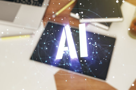 Creative artificial Intelligence symbol concept and modern digital tablet on background, top view. Multiexposureの写真素材