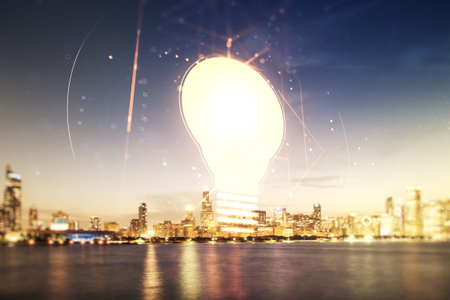 Double exposure of creative light bulb hologram on Chicago city skyscrapers background, research and...
