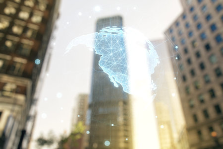 Double exposure of graphic America map hologram on blurry cityscape background, big data and digital...