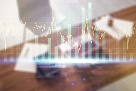 Abstract creative financial graph and modern desktop with computer on background, forex and...