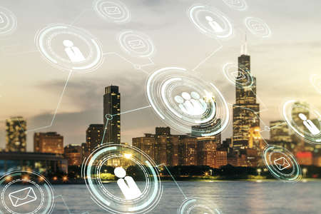 Double exposure of social network icons hologram on Chicago office buildings background. Networking conceptの写真素材