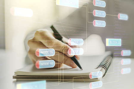 Abstract creative coding concept with man hand writing in notebook on background. Multiexposureの写真素材