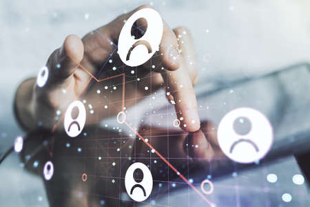 Double exposure of social network icons concept with finger clicks on a digital tablet on background. Marketing and promotion conceptの写真素材